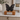 Black Ceramic Butterfly-Shaped Keepsake Ashes Urn on a memorial plinth with a silver plaque