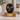 Eternal Black Metal Pet Ashes Urn on a memorial plinth with a brass plaque