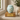 Tiffany Grace Metal Pet Ashes Urn on a memorial plinth with a brass plaque