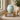 Tiffany Grace Metal Pet Ashes Urn on a memorial plinth with a silver plaque
