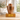 Superior Copper Leaf Single Ashes Urn on a memorial plinth with a brass plaque